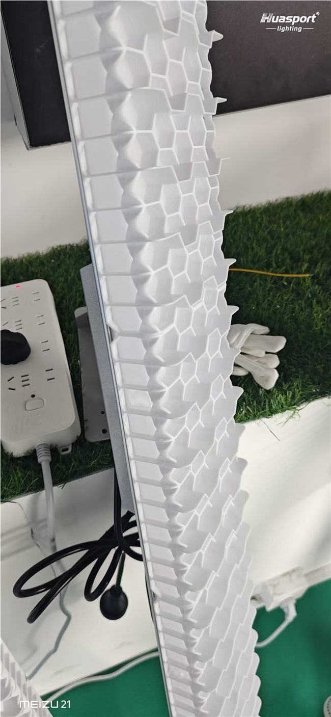 Close-up of Huasport S90 anti-glare optical lens for badminton court lighting