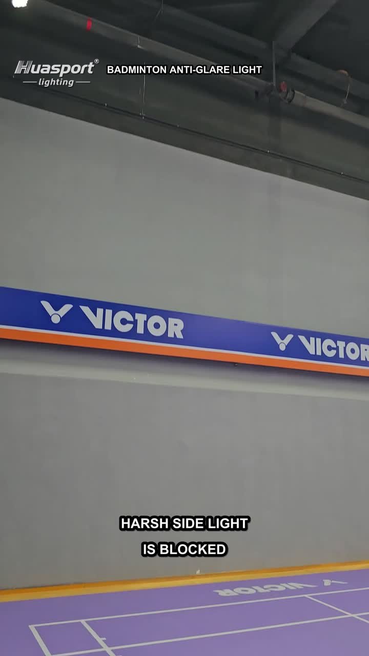 Indoor badminton court lighting fixture row showing side glare control above the court