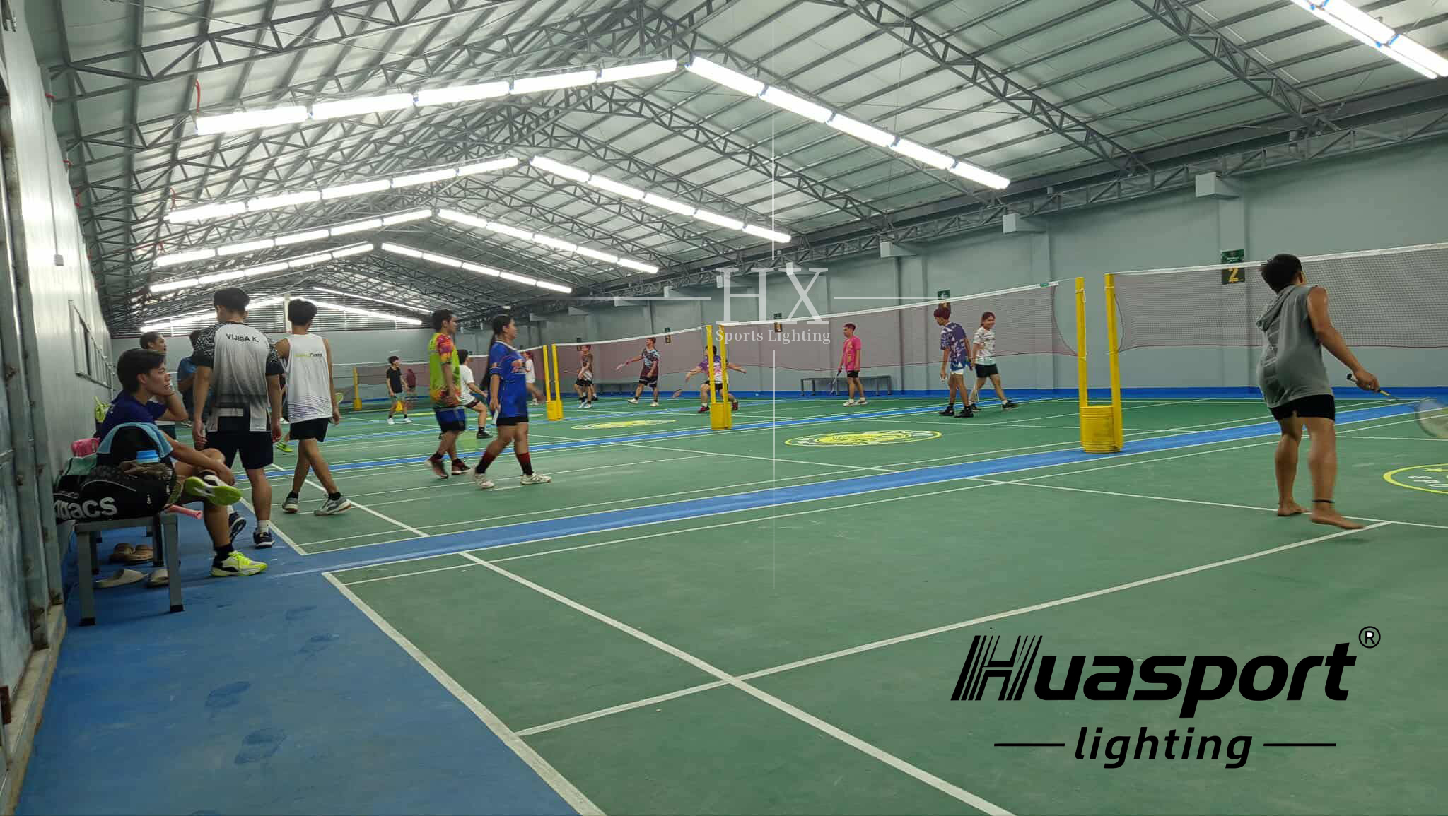 Philippines indoor court lighting rows with Huasport long-bar fixtures above multiple courts