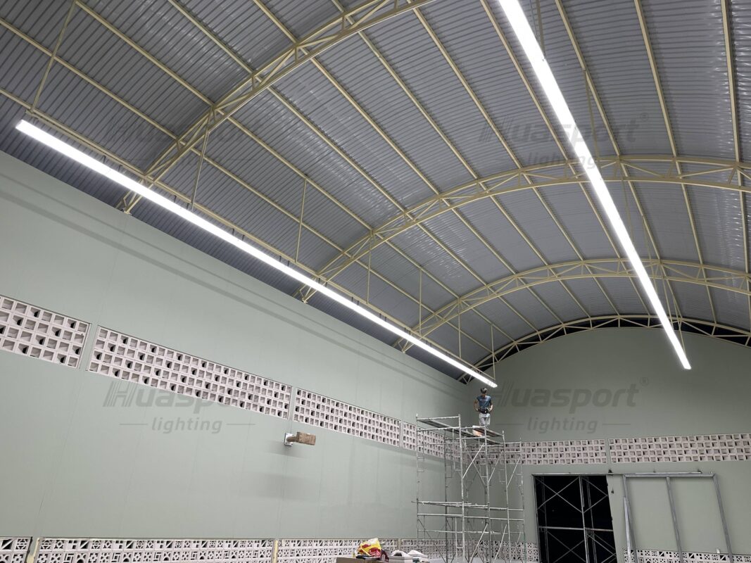 Vietnam indoor badminton court lighting installation stage with Huasport long-bar anti-glare fixture rows