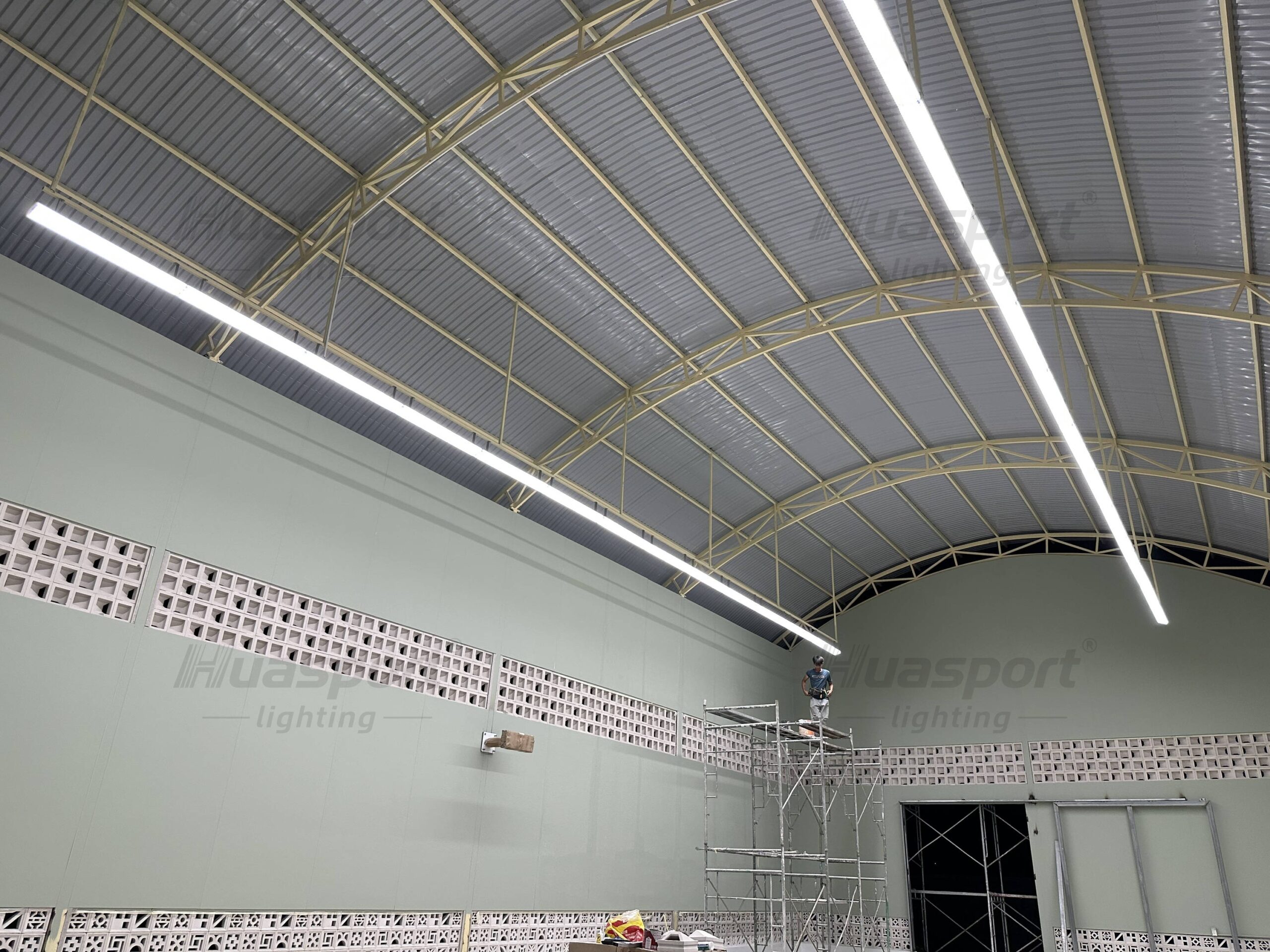 Vietnam indoor badminton court lighting installation stage with Huasport long-bar anti-glare fixture rows