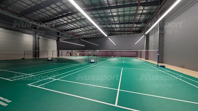 Australia badminton hall lighting reference with green courts and long-bar rows before opening