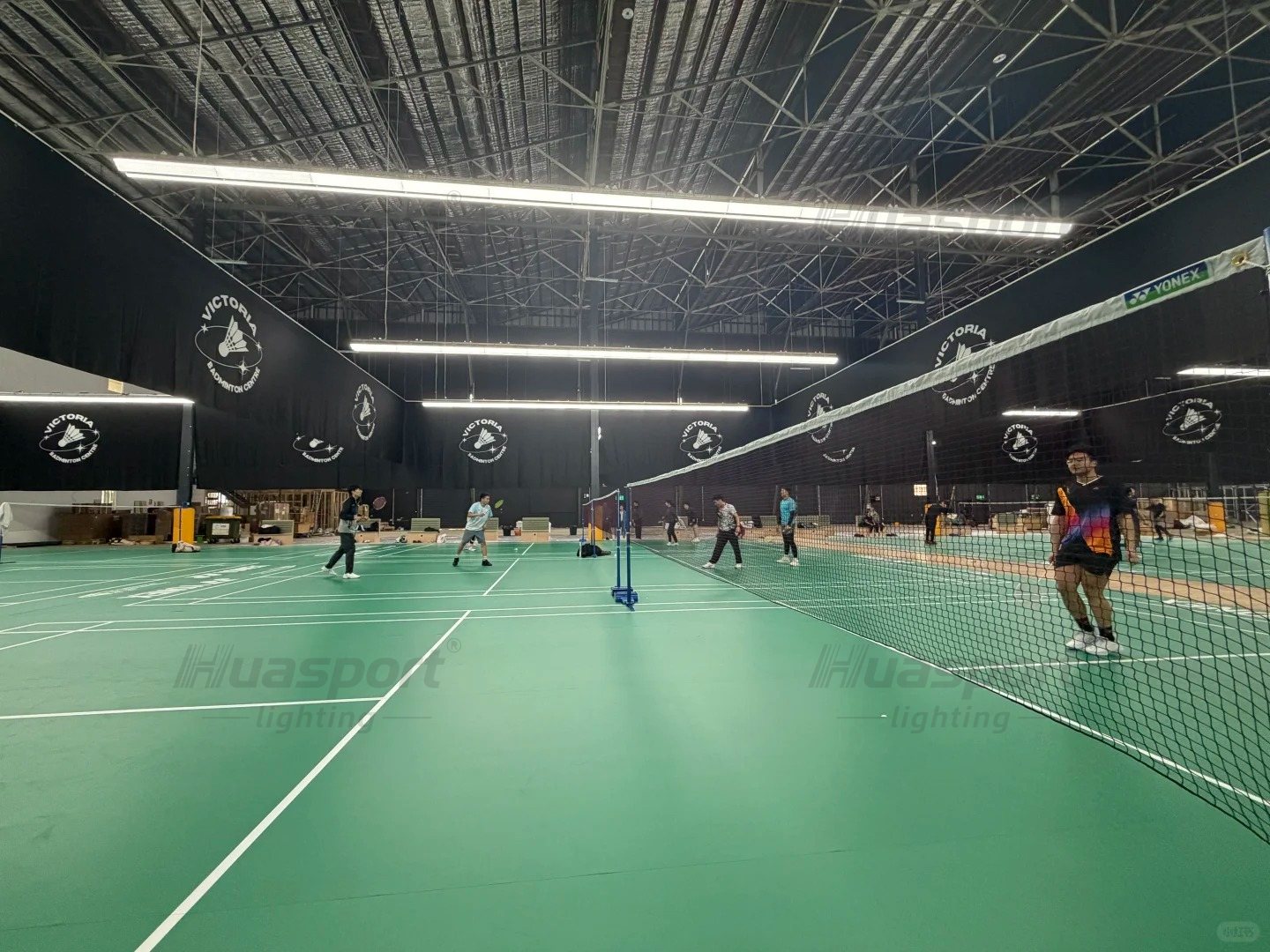 Australia badminton court lighting in a dark-ceiling hall with Huasport SAA 60W long-bar anti-glare fixture rows