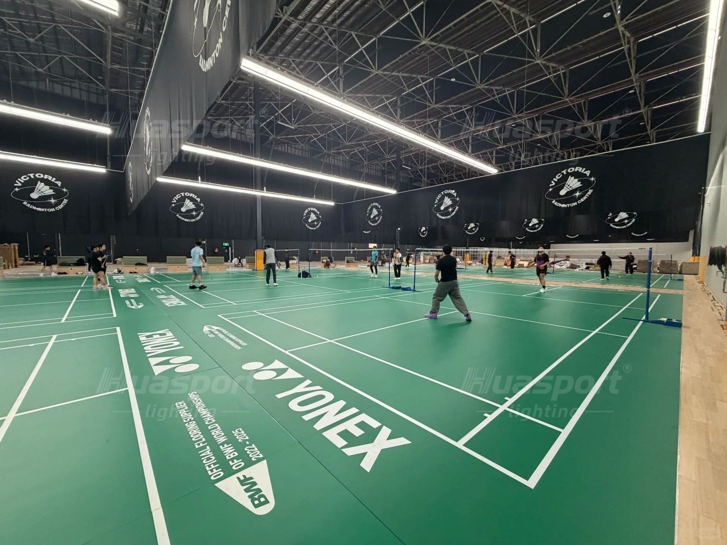 Australia multi-court badminton hall with long-bar anti-glare lighting rows along both sides
