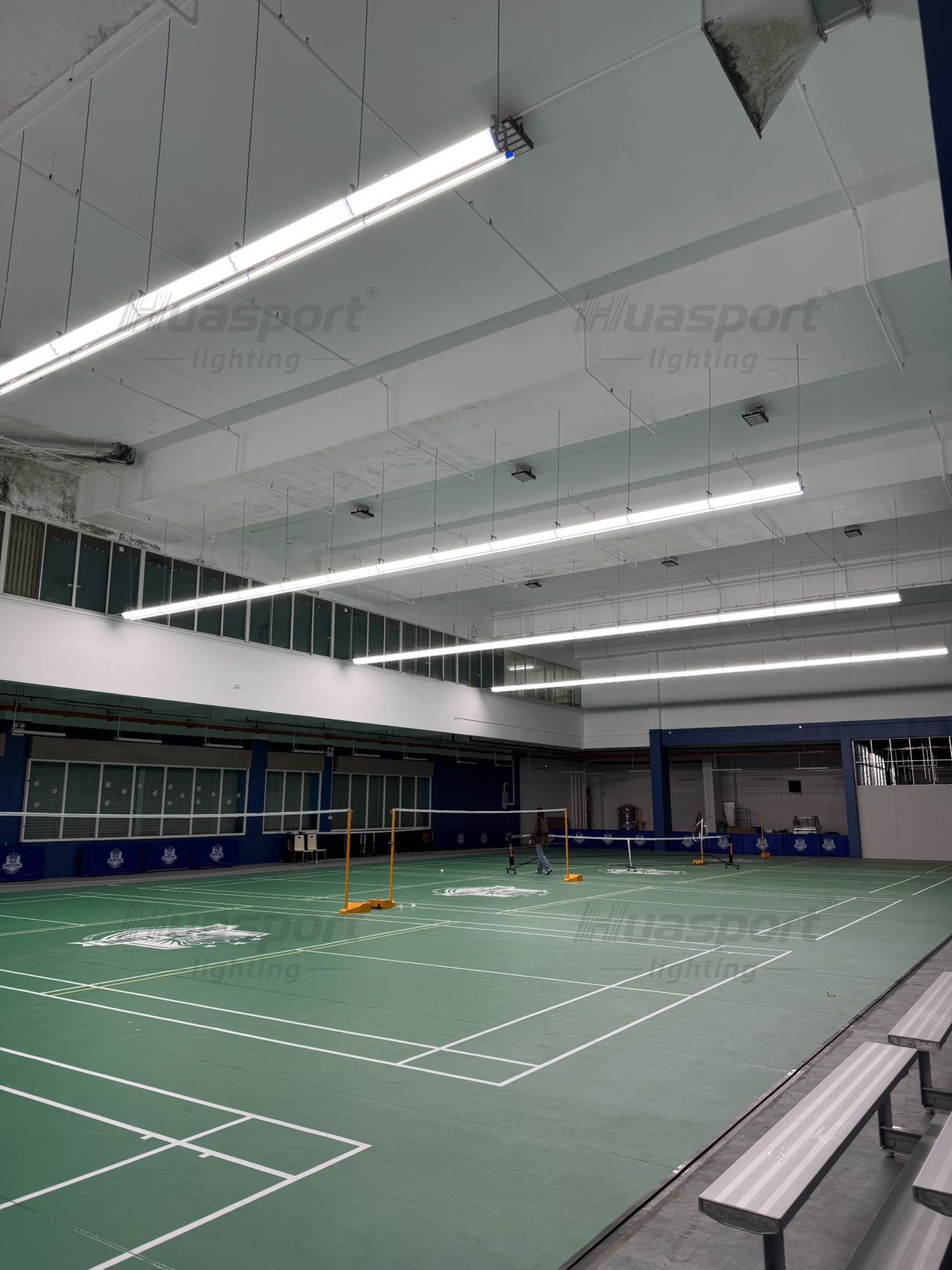 Brunei indoor badminton hall row alignment with anti-glare long-bar court lights and roof structure
