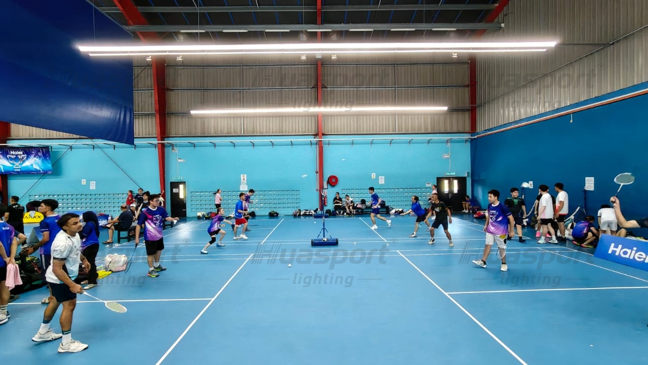 Malaysia badminton training court with long-bar anti-glare lighting rows for player comfort