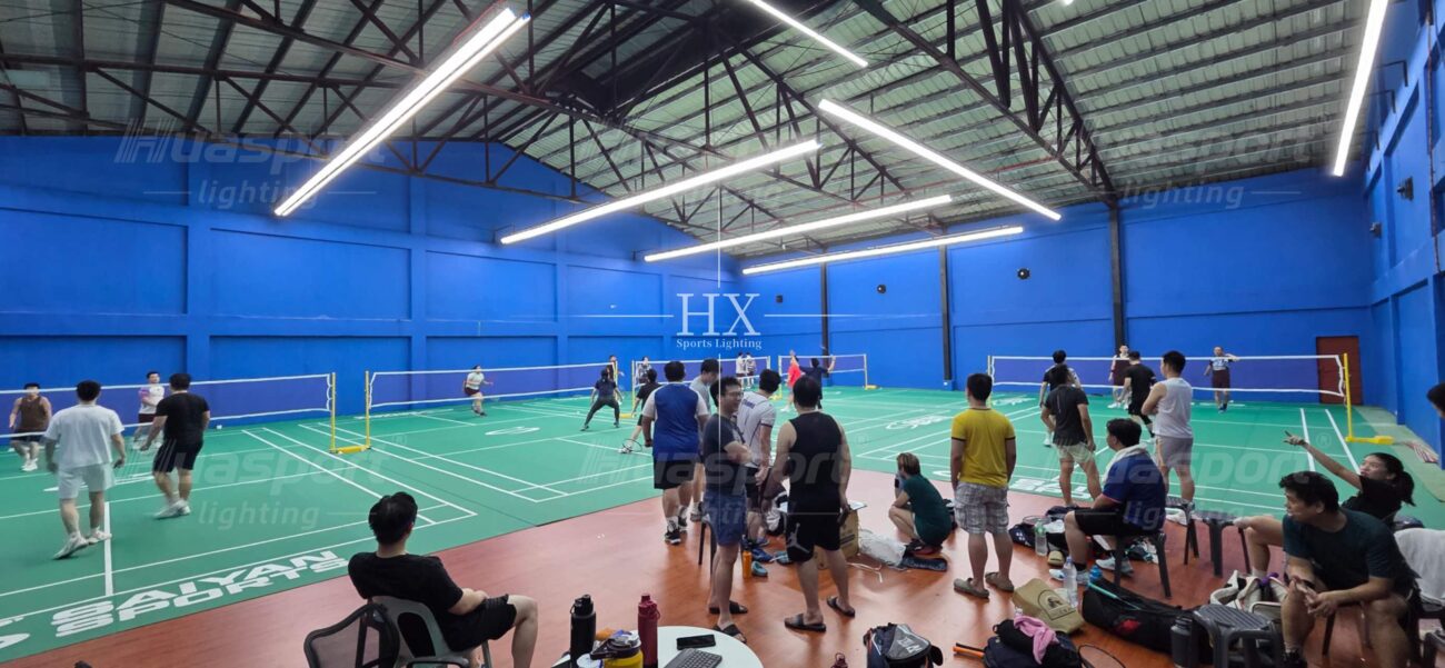 Philippines badminton court lighting reference with blue walls active courts and long-bar rows