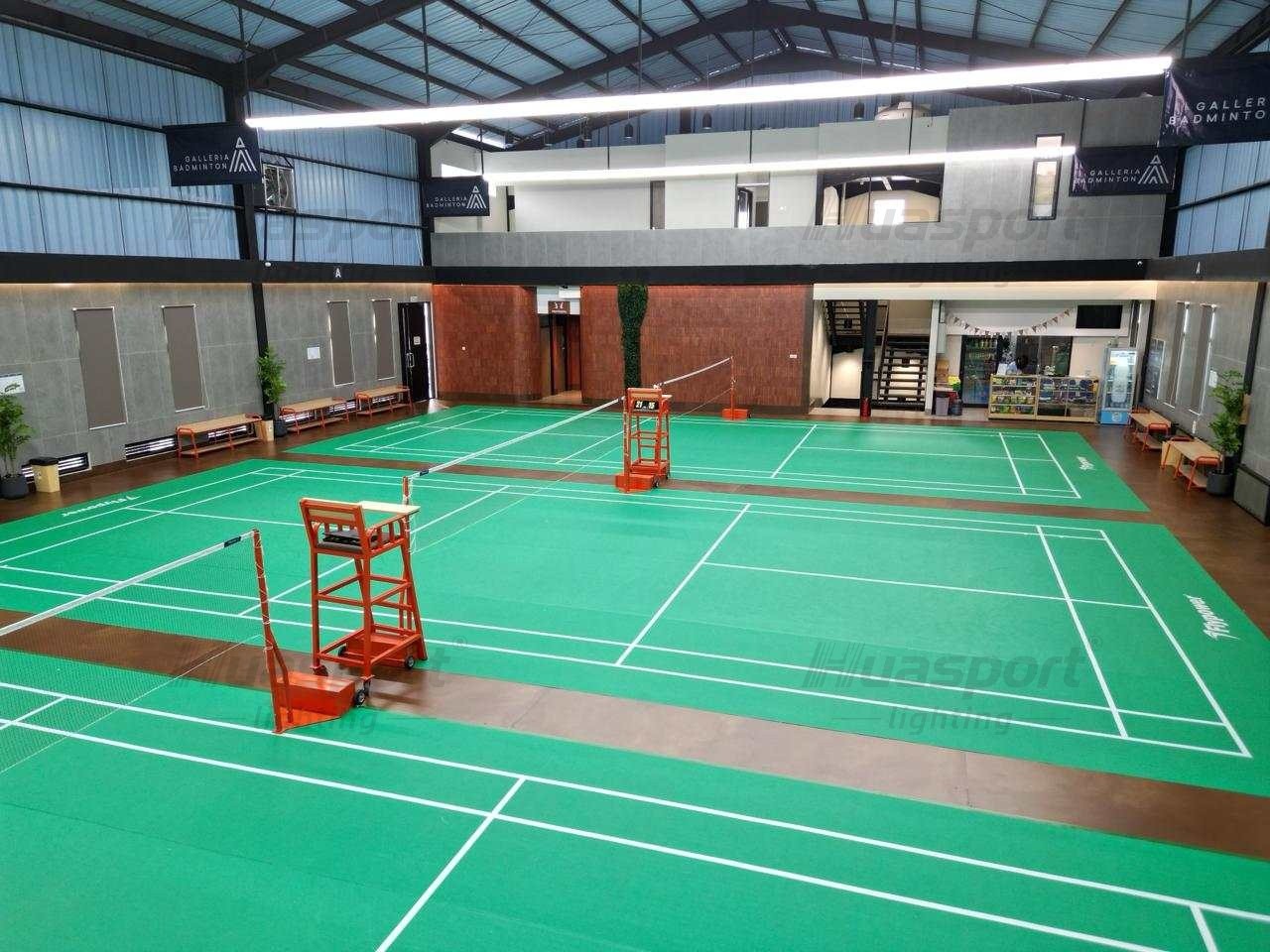 Philippines indoor sports hall showing the long-bar lighting row along the ceiling and the viewing gallery behind the courts