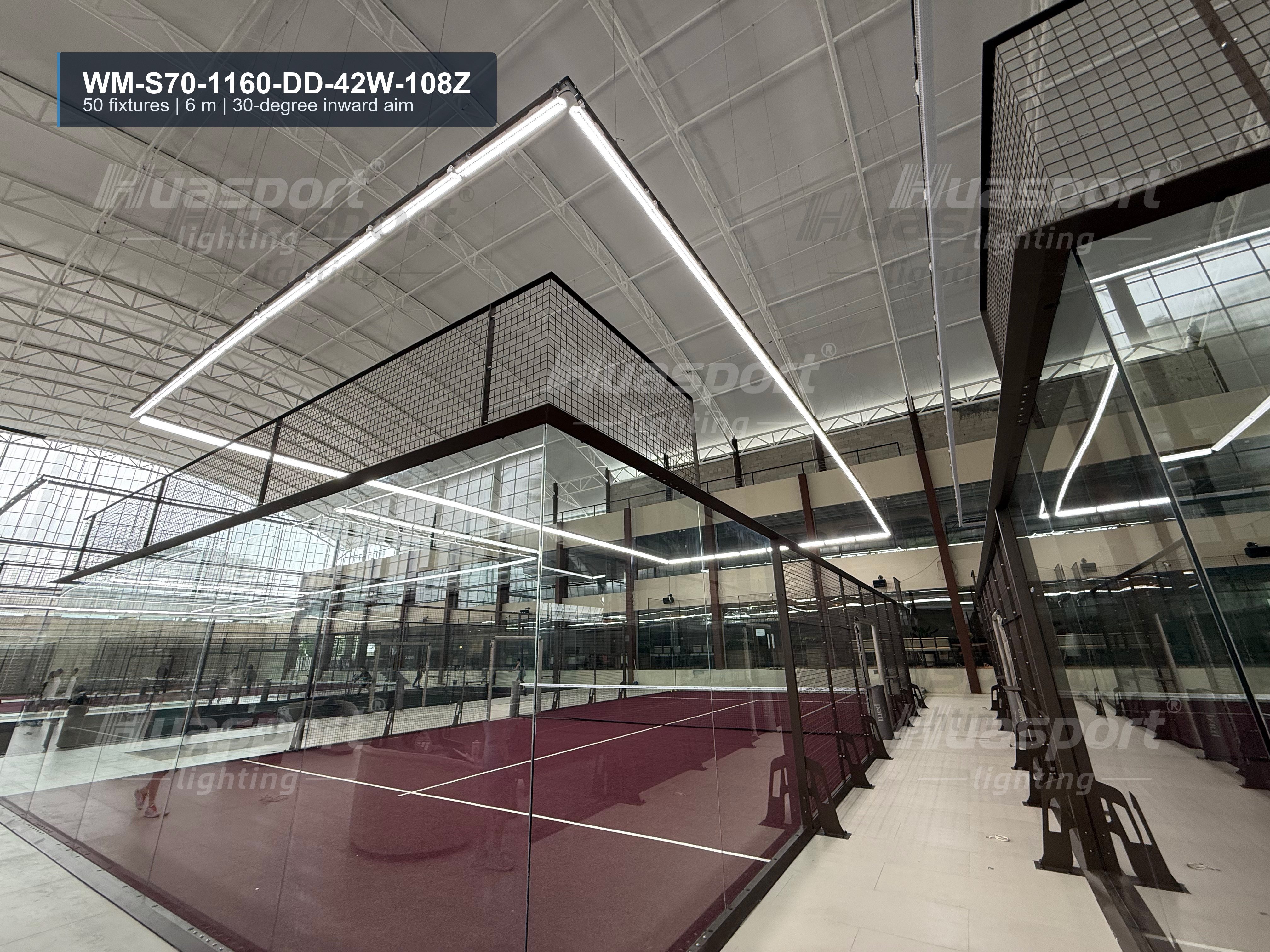 Philippines indoor padel court lighting with Huasport S70 long-bar fixtures above glass-wall courts.
