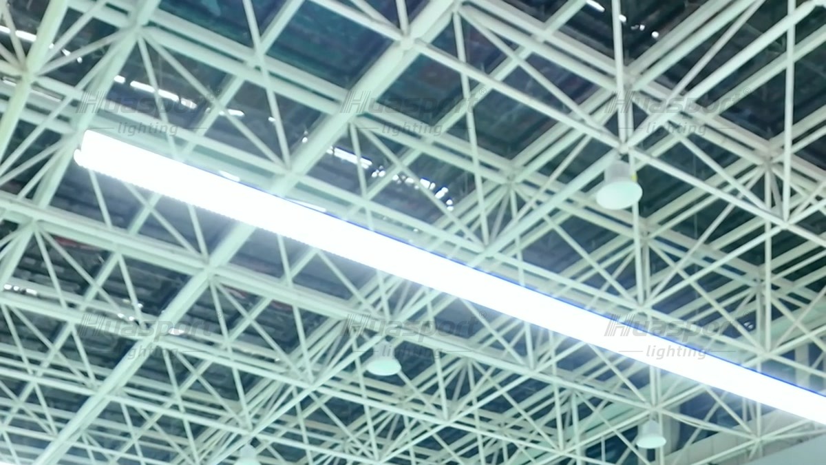 S90 badminton hall lighting row under a white roof truss in a Jinjiang badminton court