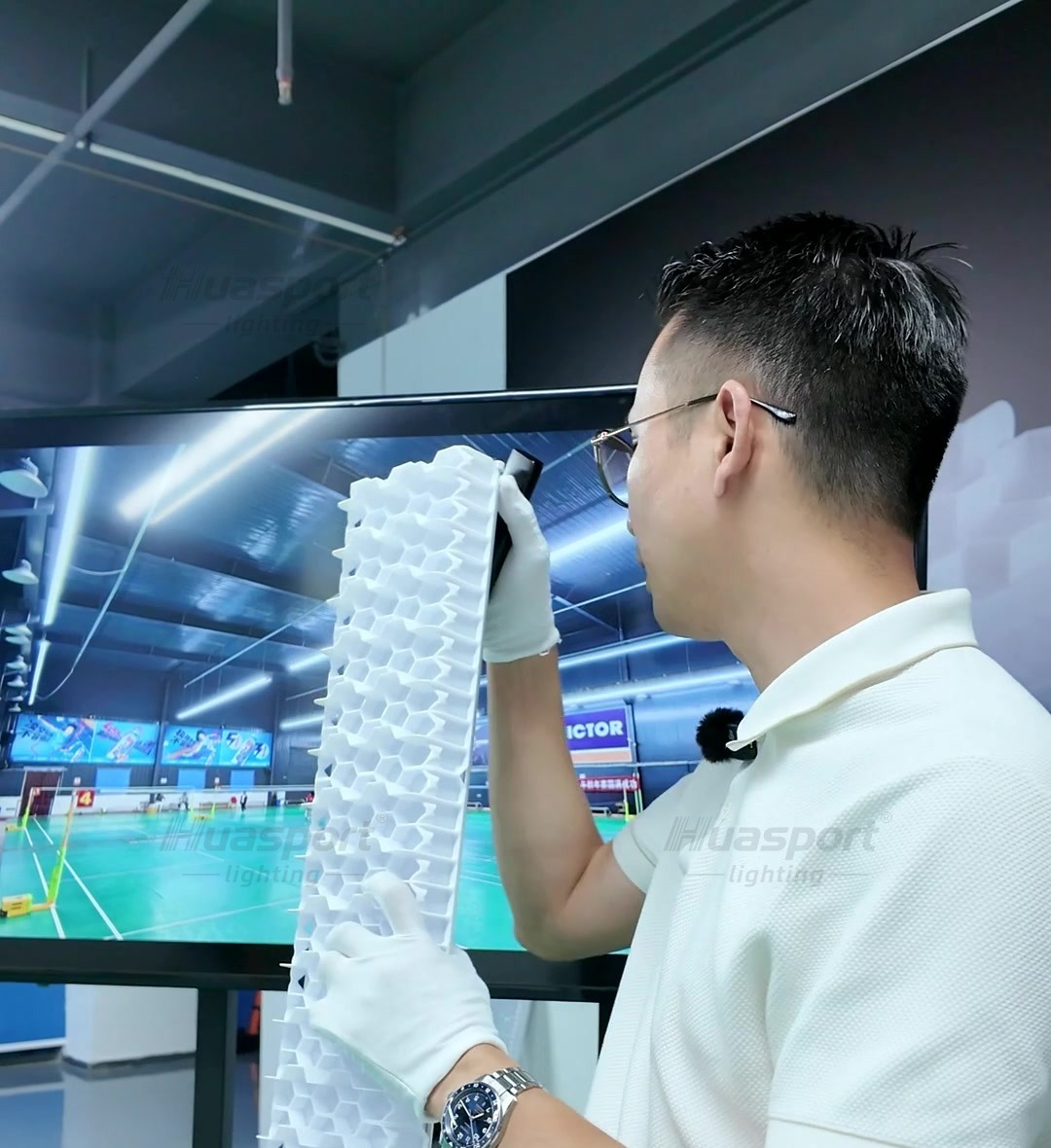 Huasport S90 double-layer grille shown from a badminton hall player-view demonstration