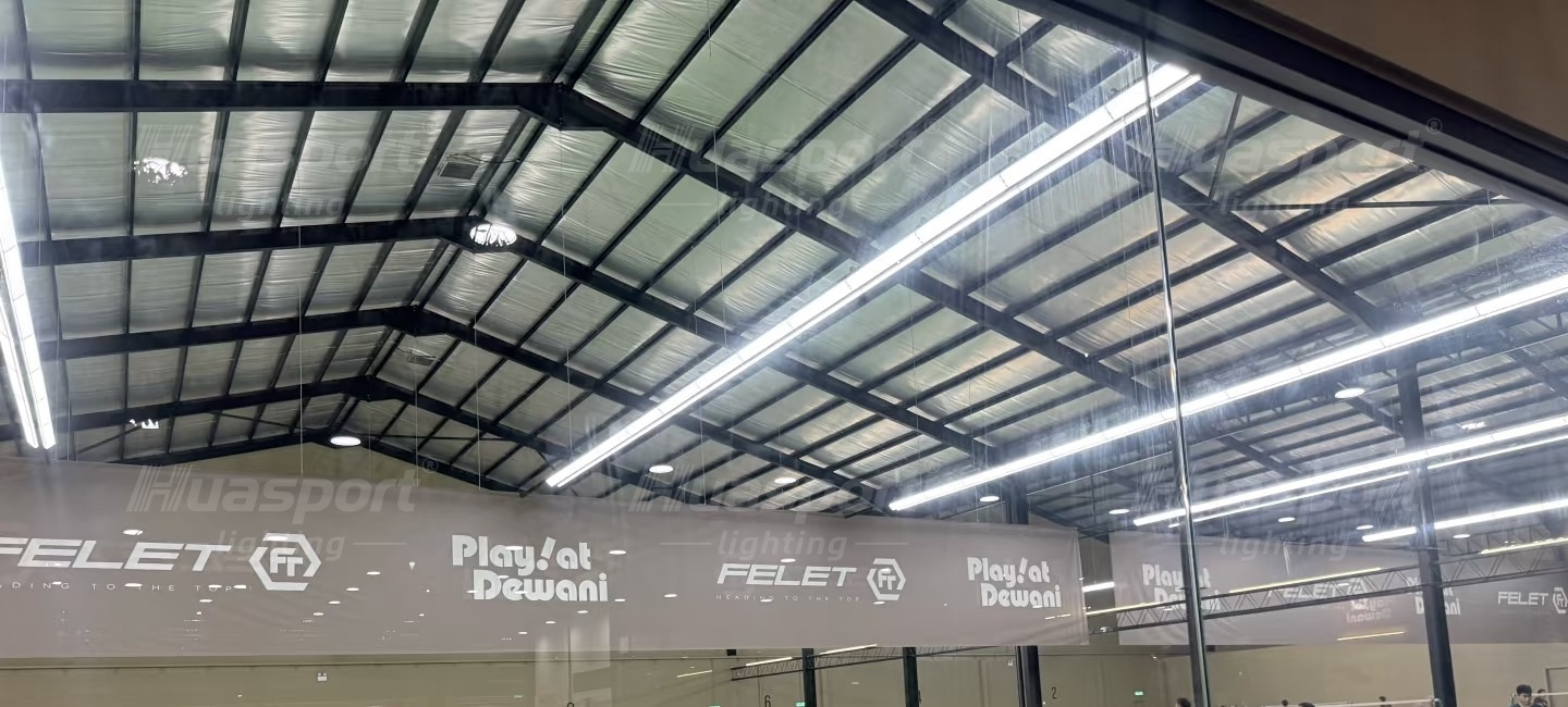 Malaysia badminton hall lighting reference showing long-bar rows above multiple courts